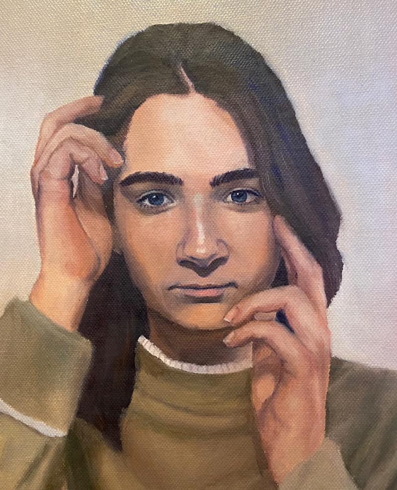 Oil portrait with hands framing the face.
