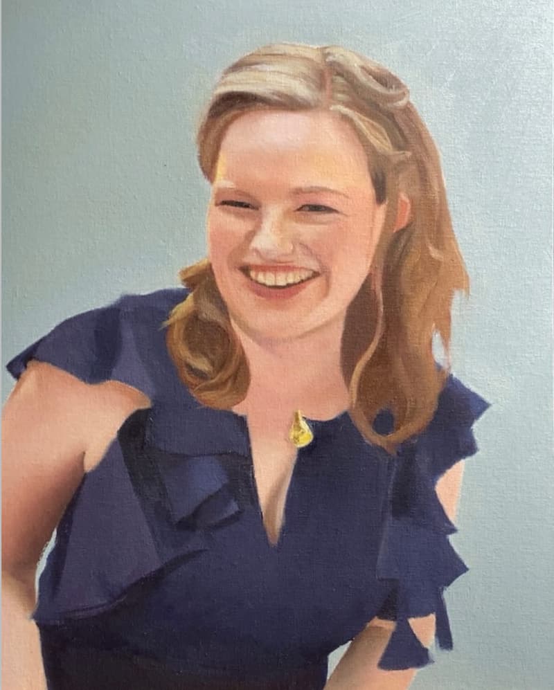 Oil portrait of a smiling woman in a navy dress.